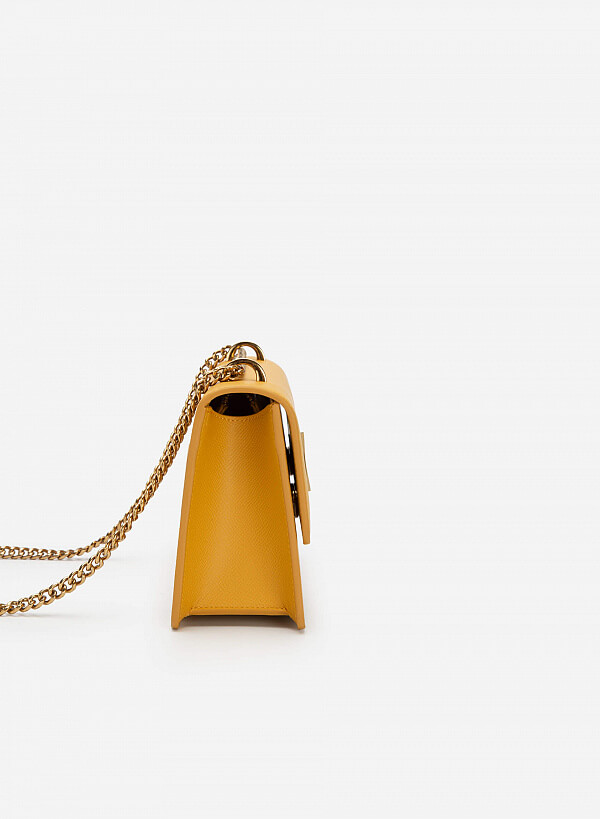 Túi đeo chéo khóa kim loại hình nơ dây quai xích - SHO 0193 - Màu vàng - VASCARA