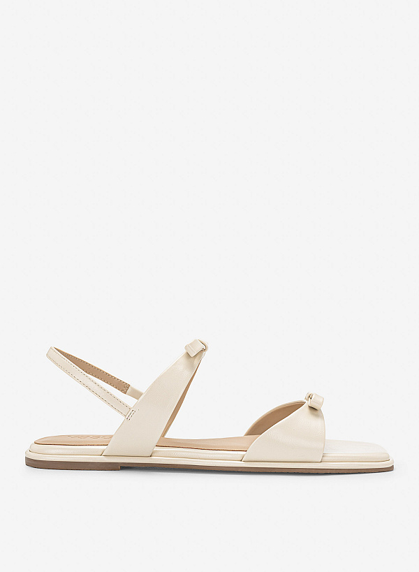 Sandals đế bằng họa tiết nơ cá tính - SDK 0355 - Màu kem