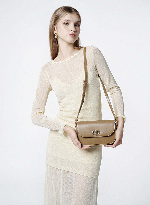 Túi đeo chéo nắp gập nhấn khóa xoay