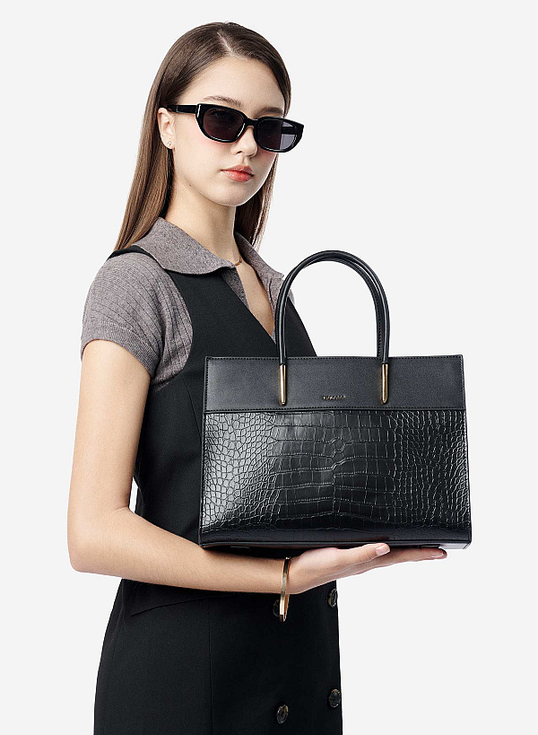 Túi xách tay vân cá sấu nhấn chân quai