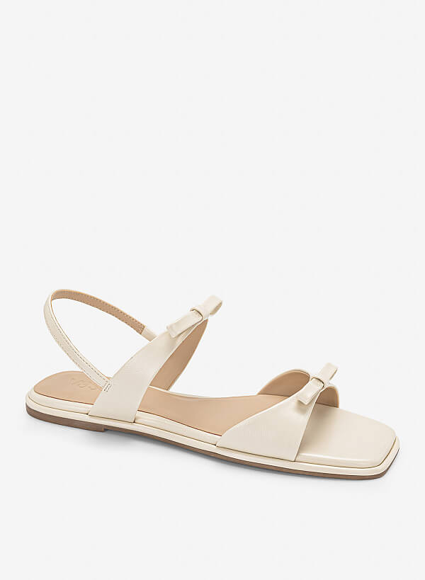 Sandal đế bằng họa tiết nơ cá tính